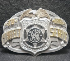 XC23104 GOOD VINTAGE 1996  SMITH  WESSON TO PROTECT  SERVE  GUNS BELT BUCKLE