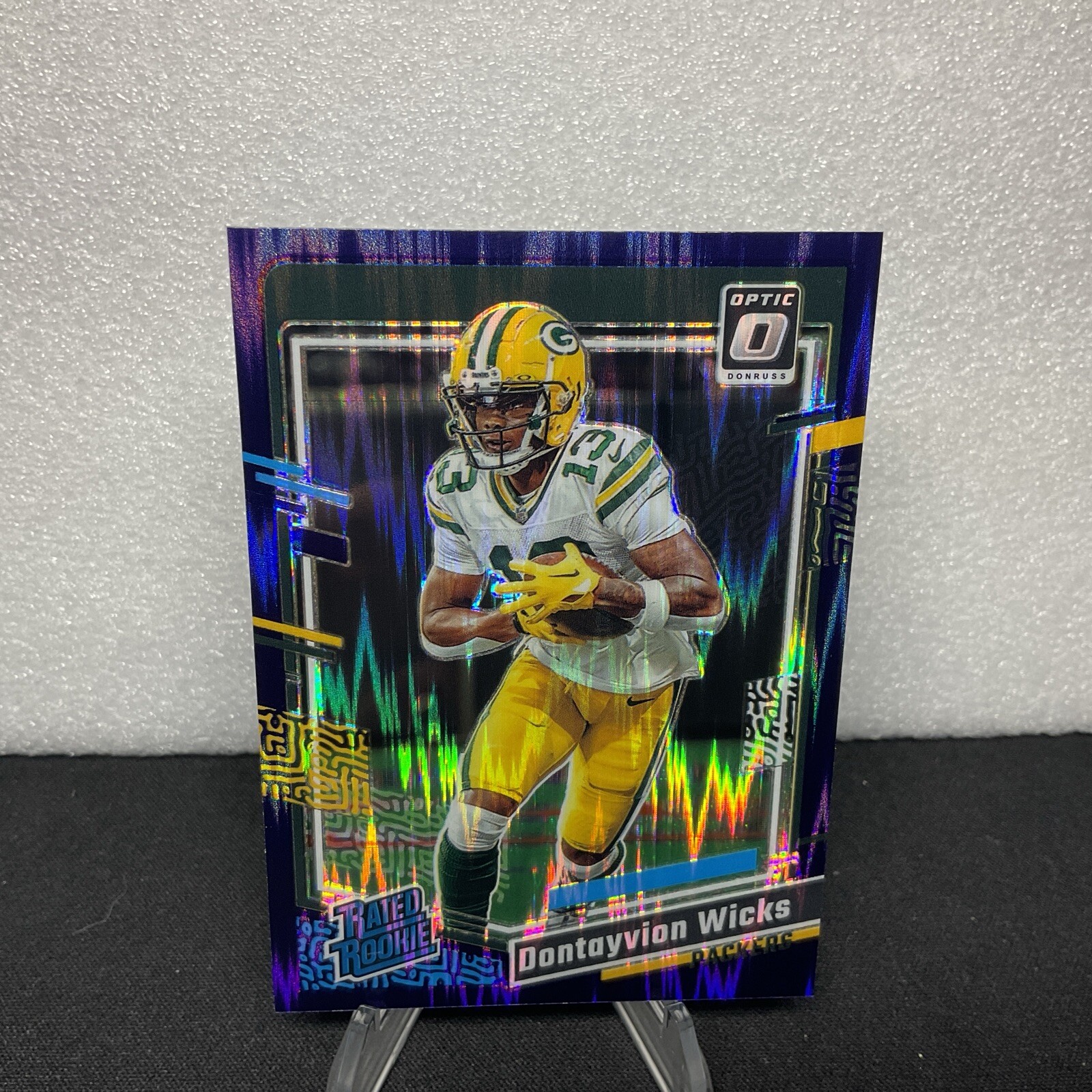 2023 Panini Donruss Optic - Rated Rookie Purple Shock #249 Dontayvion Wicks (RC)