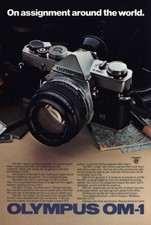 1979 Olympus OM-1: On Assignment Around the World Vintage Print Ad