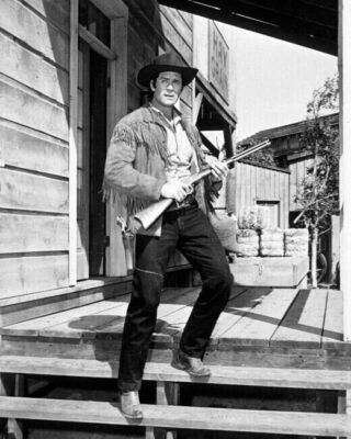 Clint Walker full length pose as Cheyenne Bodie holding rifle 11x17 inch Poster
