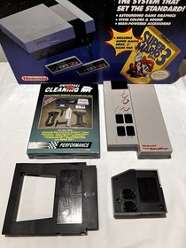 Nintendo NES Challenge Set Console With 12 Games And Cleaning Kit.