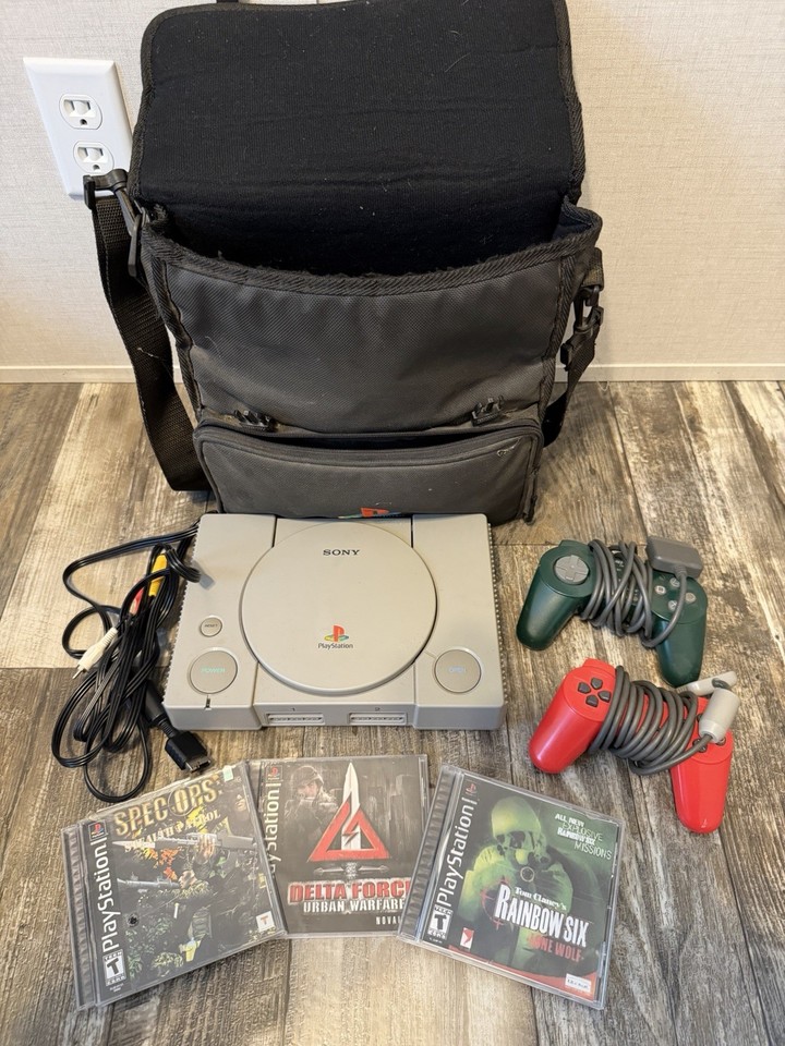 A complete PS1 bundle with two controllers, three games, and the original carry bag — the definitive 90s console in ready-to-play condition.