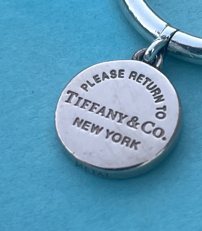 Rare Return to Tiffany & Co NY Dangling Round Tag Ring Metal