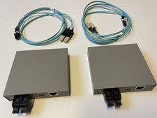 Two Allied Telesyn AT-MC116XL Media Converters and two 2M SC to LC MM Cables