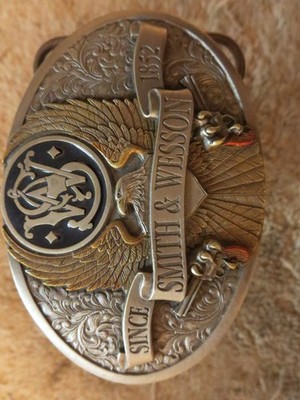 S&W ''Since 1852'' belt buckle by Bergamot. Pewter and brass w/some colored parts
