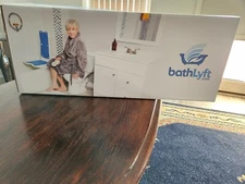 Selling a Bath lyft powered chair. White, Used