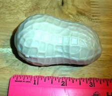 Splat Peanut toy, splats flat then morphs back throw on a smooth clean surface