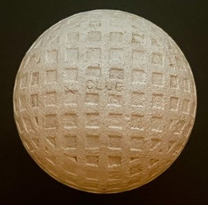 C. 1920's THE CLUB SQUARE MESH PATTERN Golf Ball