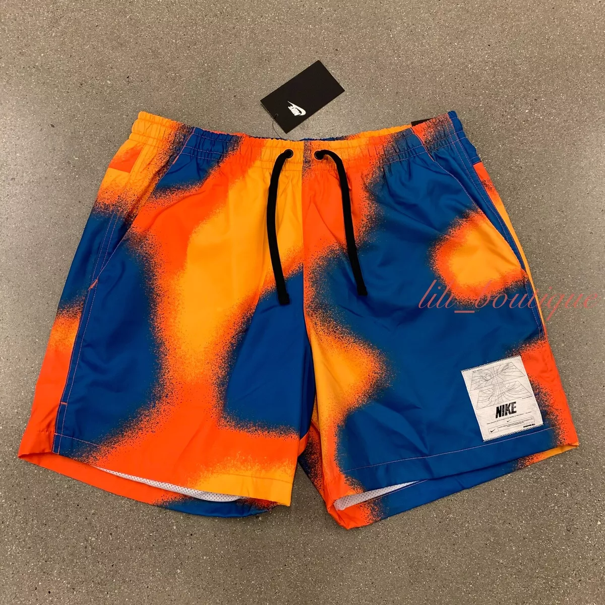 Nike standard fit mid thigh on sale length shorts