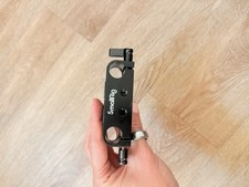 SmallRig baseplate with dual 15mm rod clamps, used for camera mounting