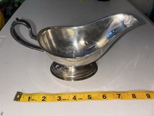 Ancien serveur à sauce sur pied sans marque bateau à sauce argentée