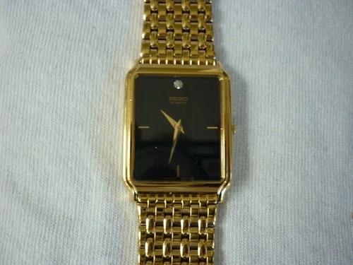 VINTAGE SEIKO QUARTZ WATCH DRESS MENS BLACK DIAL GOLD TONE NEW BATTERY