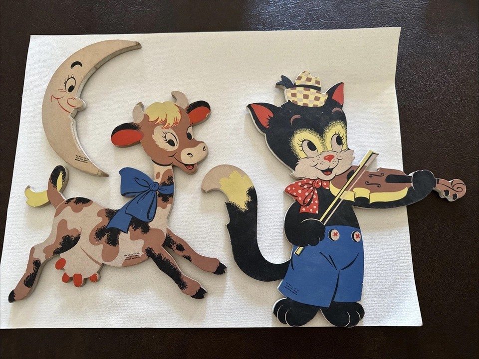 Genuine 1950s 'Hey Diddle Diddle' cat-and-fiddle wall hanging — an actual vintage nursery relic with real mid-century whimsy.