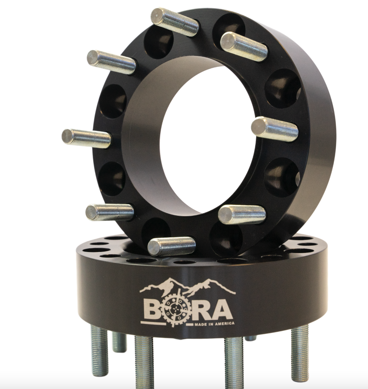 Black BORA rear spacers with 5.5-inch diameter, featuring mounting holes and “BORA Made in America” text on a mountain backdrop.