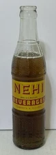 SCARCE VINTAGE ACL & EMBOSSED NEHI RC SILK SODA BOTTLE 9 OZ. SENATOBIA, MISS.