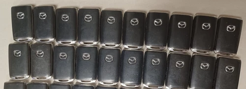 Lot of 20 Genuine OEM Mazda Remotes 4 Button Hatch TAYB-67-5DY  FCC:WAZSKE13D03 - product listing photo