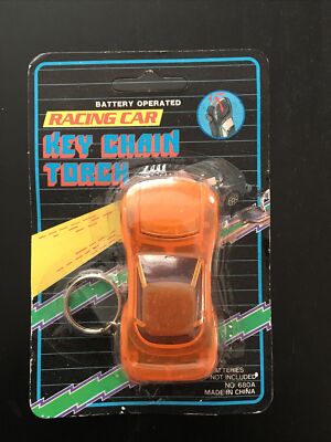 VINTAGE 1990 s ORANGE TOY RACE CAR KEY CHAIN w/TORCH LIGHT UNOPENED NOS   