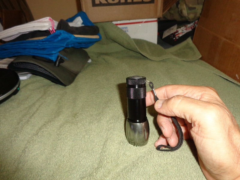 mini led flash light, black on end aluminium tone on the other