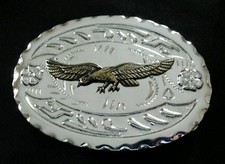 SPREAD WING BRASS TONED EAGLE WESTERN BELT BUCKLE SILVER TONED BACKGROUND