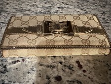 Authentic Gucci Bronze Trifold Wallet With gold tone Buckle