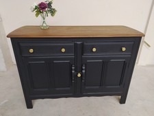 Ercol vintage sideboard, two door cupboard, matt black with gold handles