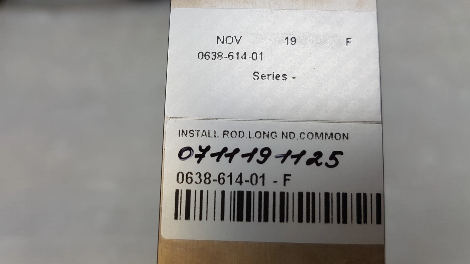 Labels on the Lumenis part: INSTALL ROD, LONG ND, COMMON, 0638-614-01 - F