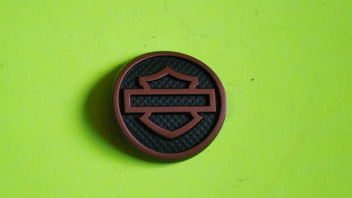 1 NOS OEM Harley Davidson Orange with Texture Medallion P/N