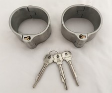 A Pair of Used Unisex Oval Shape Detached Stainless Steel Handcuffs 4 cm high .