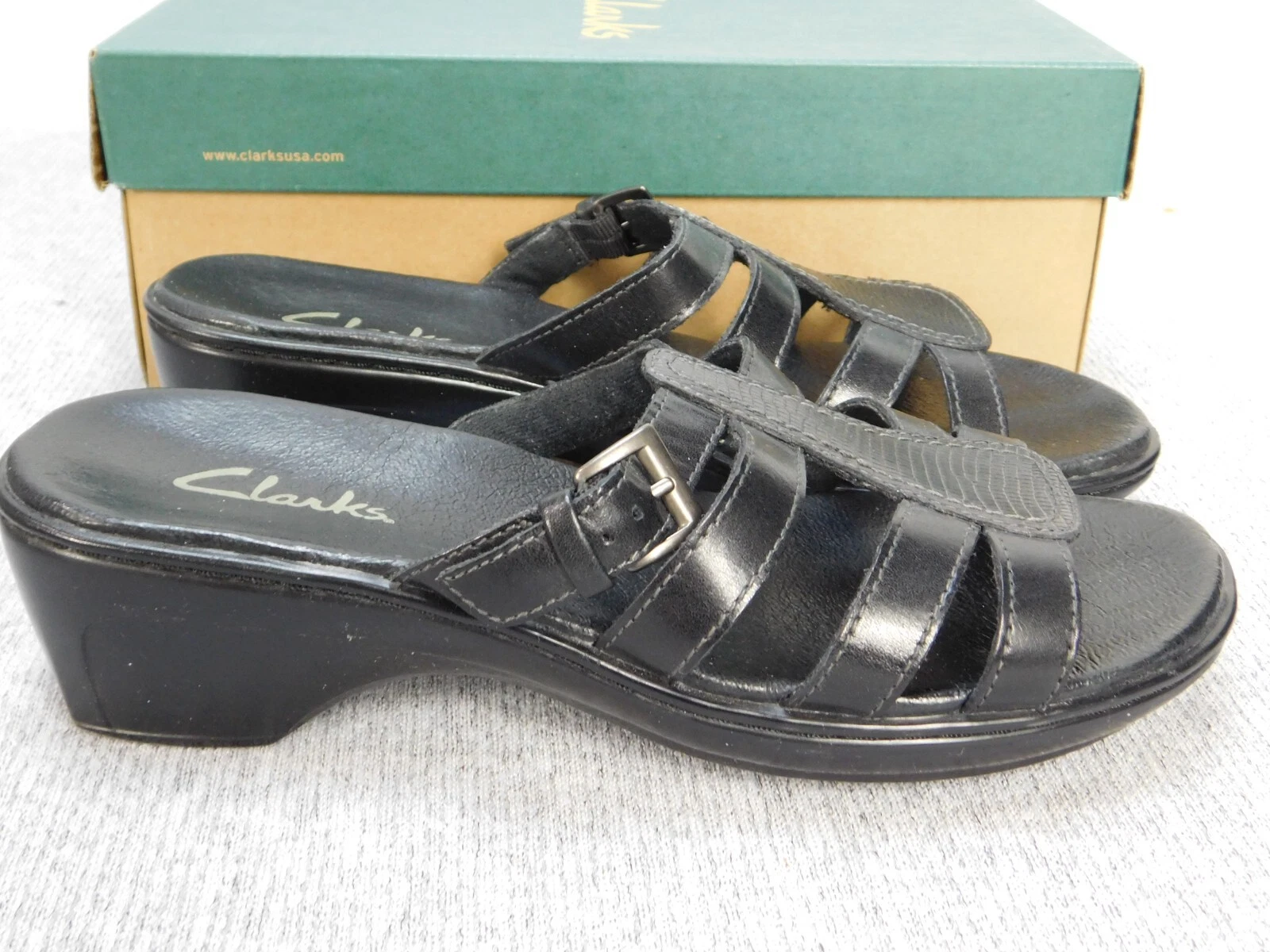 Sandali Clarks Taylor con zeppa e cinturino da donna 7 W in pelle nera slip on