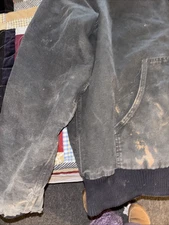 carhartt jacket. ( Tag Unreadable) Distressed Areas And Zipper Works But No Pull