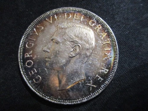 1952 Canadian King George VI Toned with water lines Silver Dollar