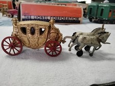 VINTAGE cast iron carriage, gold w red wheels