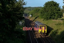 PHOTO  CLASS 156  2-CAR DIESEL UNIT 156438 HAS JUST PASSED BRAMPTONFELL CROSSING