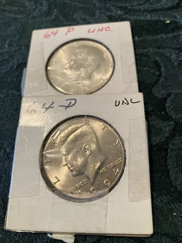 1964 Lot Of 2 Kennedy Half Dollars D and P, Unc Slight Toning On “D”