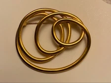 Vintage Crown Circle of Life gold-tone brooch with a brushed finish