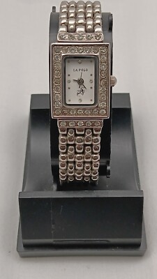 LA POLO, LADIES WATCH,GEMMED BEZEL, CHAMPAIGN DIAL,NEW BATTERY