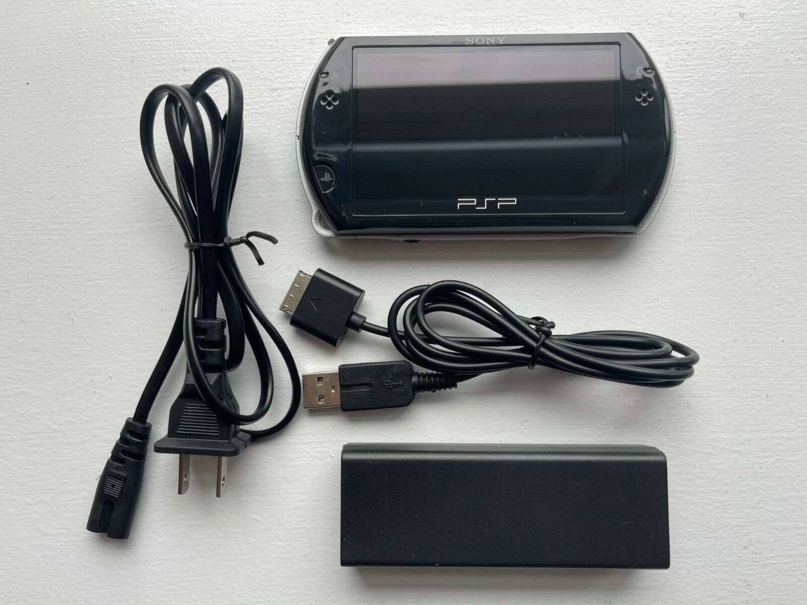 Sony PSP Go - PSP-N1000 Piano Black 100% OEM + Wall Charger Good Condition 4948872412193 |