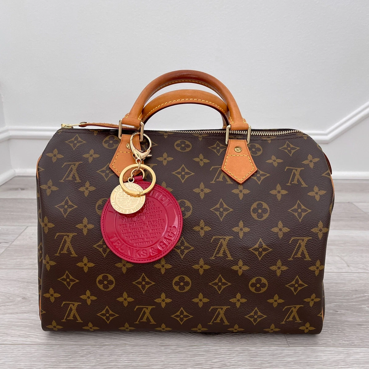 Louis Vuitton Dog Bag Charm and Key Holder Monogram Brown in Calf