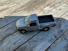Modell Auto Ford F 150 Pick Up silber, 1997, WELLY No 49737, ca. 11,7 cm lang 