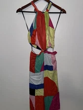 Multi-coloured block print jumpsuit  with tie-up front and cut out detail.