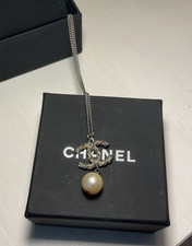 Genuine Chanel necklace in original box. Reversible drop with 2 chain lengths.