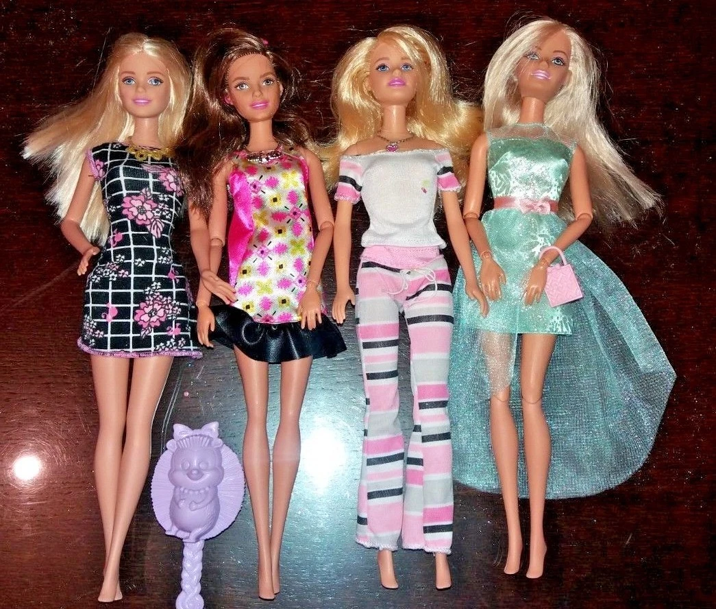 Four barbie doll sale