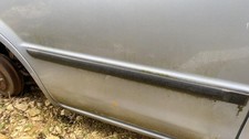 Baguette de porte Mazda 323