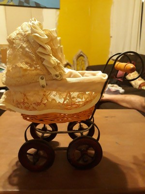 white wicker doll carriage