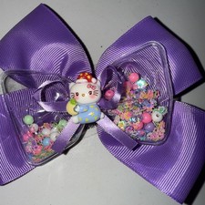 Yellow Hair Bow W/Hello Kitty In The Center With Clear Bow Full Of Glitter
