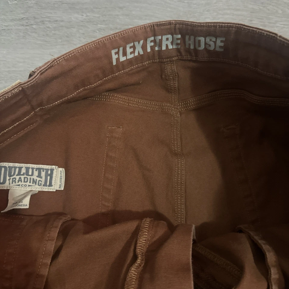 Pantalones comerciales Duluth para hombre 38x30 manguera flexible contra incendios para hombre ajuste relajado naranja utilitario Foto 2 de 4