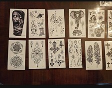 Temporary tattoo sheets featuring various designs - Some Are Missing