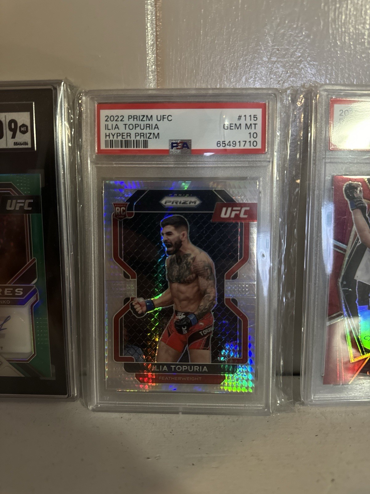 2022 Panini Prizm UFC - Ilia Topuria #115 Hyper Prizm (RC) PSA GM 10