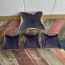 Dick Knox California Pottery square dishes in a deep purple glaze with gold trim