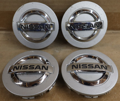 OEM Used Set Nissan Armada Titan Silver Center Caps 403427s500